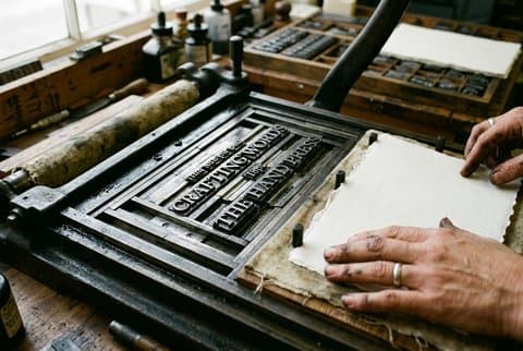 Platen of letterpress printing press on cotton paper
